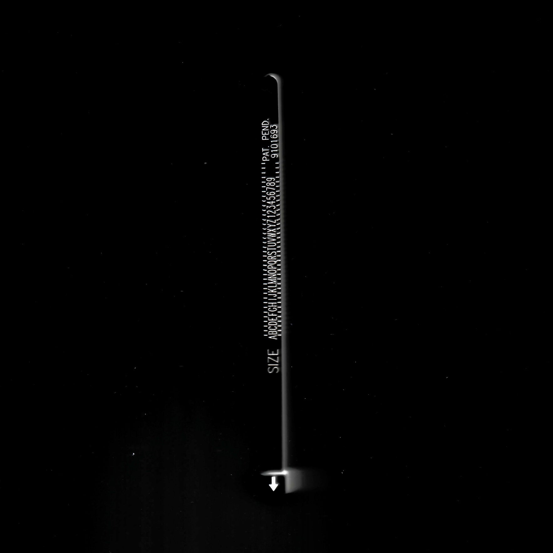 ring sizer on a black background