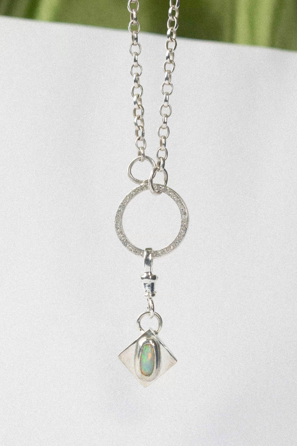 opal charm for charm necklace / bracelet on a white background 