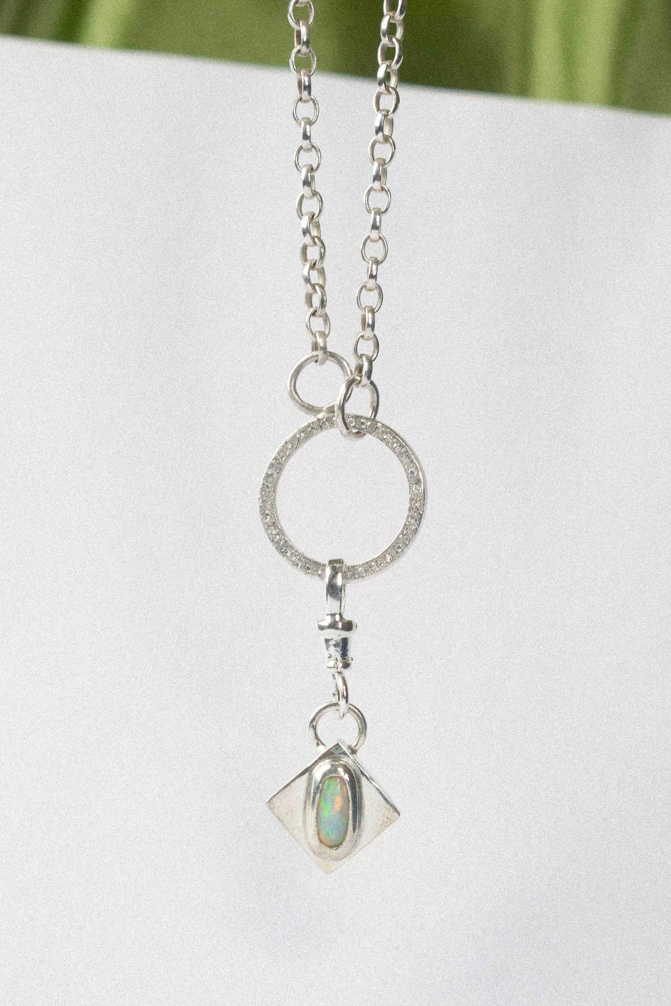 opal charm for charm necklace / bracelet on a white background 