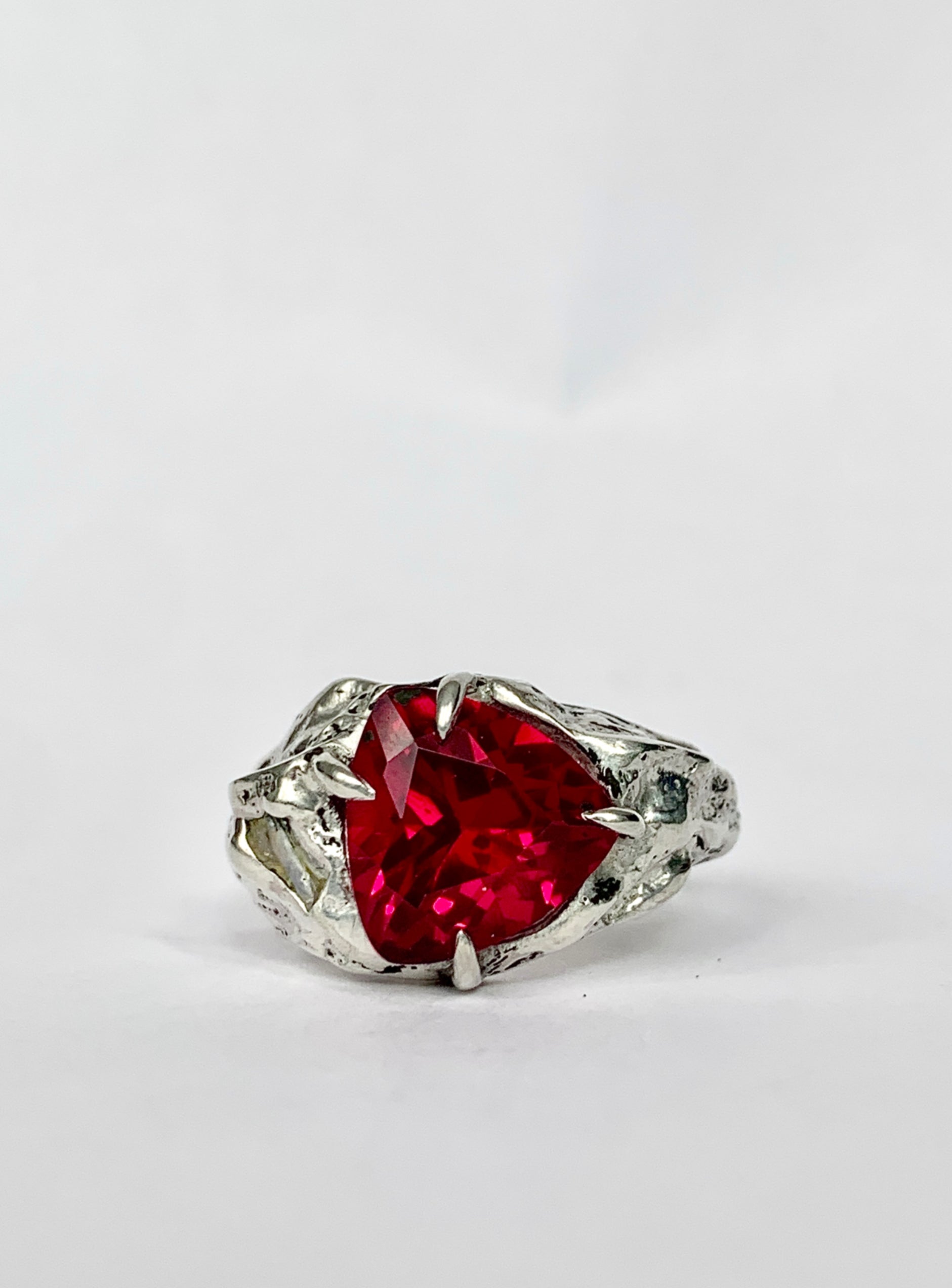 an alternative engagement ring with a large ruby in the centre